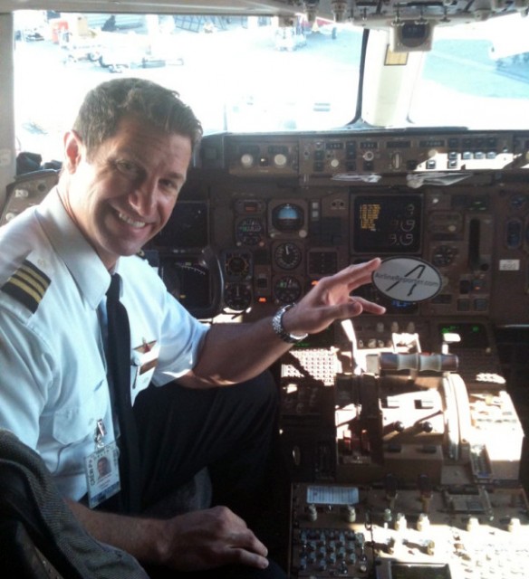 B757 Delta Air Lines Boeing 757-200 captain poses with a sticker. Taken by Russell Christensen (@von_christensen).