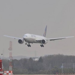 A United Airlines Boeing 777 in new livery lands.