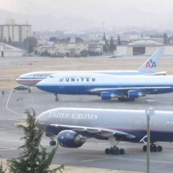 Two United and one American aircraft find parking.
