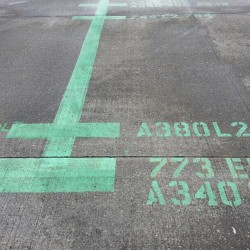 The ground is painted at gate S11 to prepare for an Airbus A380 at Seattle-Tacoma International Airport.