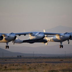 WhiteKnightTwo, christened VMS Eve after Richard Branson's mother Eve, and SpaceShipTwo, known as VSS Enterprise, take to the skies during a test flight in Mojave, CA, USA. Photo: Mark Greenberg