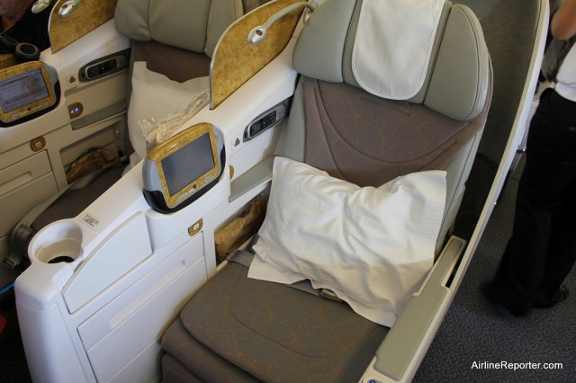 Emirate's Business Class seats offer quite a bit of room and one gianormous remote.