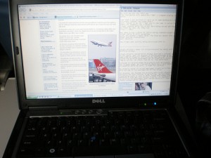 It is not easy to fit a laptop on the tray to blog