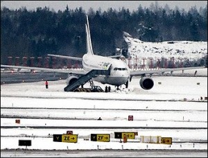 An Iran Air Airbus 300-600 stands in the snow after skidding off the runway on takeoff from Stockholm Arlanda Airport (AP Photo/Maja Suslin) 