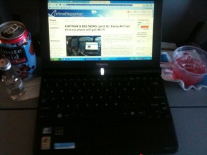 Taken right now. Glad I got a mini-laptop and yes that is an "adult" drink, but I am sitting up front & it's free!