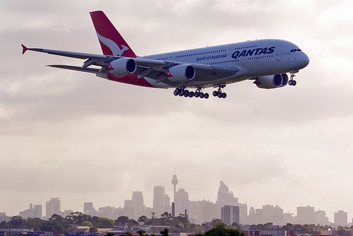 Qantas Airbus A380 with Sydney in the background. Often the A380 flies from Sydney to Singapore.