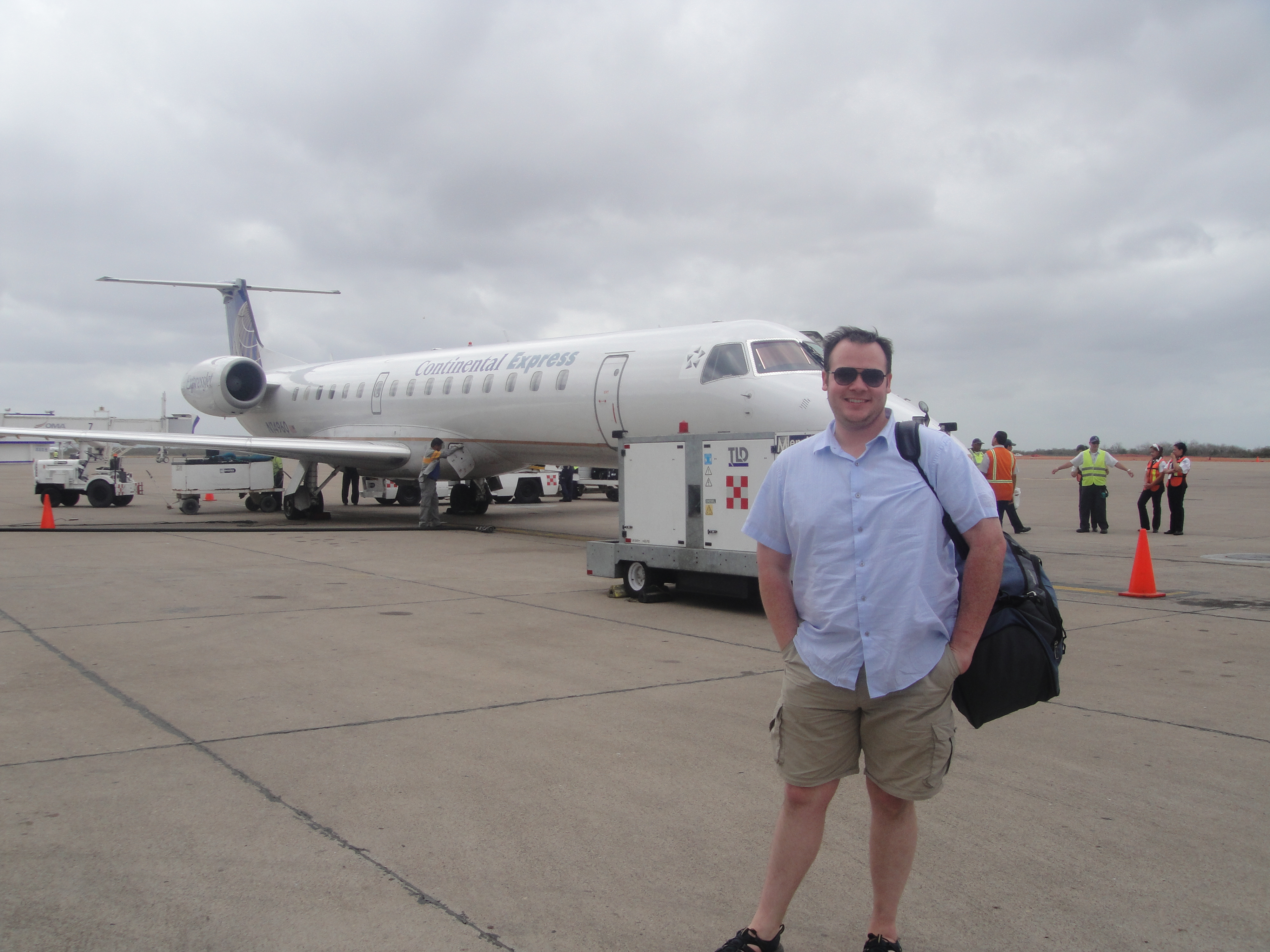 Me in front of the first ERJ-145 I flew at Mazatlan Airport. I love being able to get close to the plane on the tarmac.