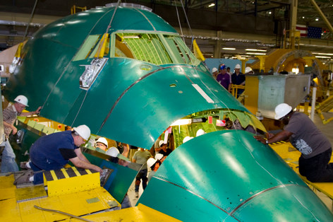 Boeing workers assemble the top portion of the Boeing 747-8 Intercontinental