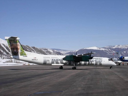 A Frontier Q400 at Aspen. Check the Delta and United planes in the background.