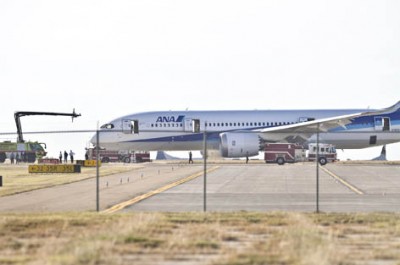 Firefighters and airport officials investigate the scene of an incident involving a Boeing 787 jetliner at the Laredo International Airport Tuesday, Nov. 9, 2010 in Laredo, Texas. (The Laredo Morning Times, Ricardo Santos)