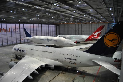 One Dreamlifter and two Airbus A380's sharing a hangar.