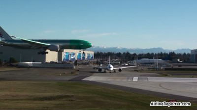A Boeing 777-200 landing in front of a Boeing 787 today at Paine Field