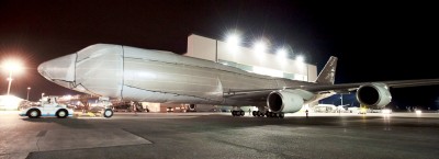 The first Boeing 747-8 Intercontinental comes out of the paint hangar all wrapped up. Won't know the livery until Sunday. Photo by Boeing.