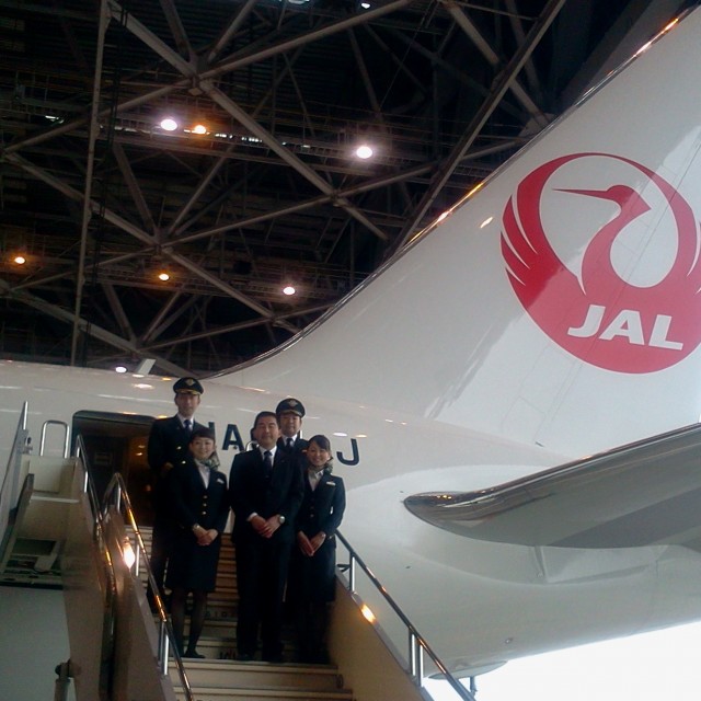 Cabin crew check out the new Boeing 767 with crane livery.