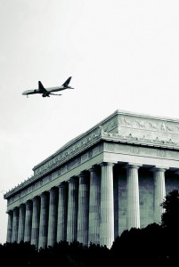 Delta plane flying over the Lincoln Memorial