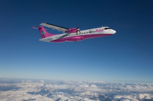 The pink livery looks great contrasted to the blue sky.