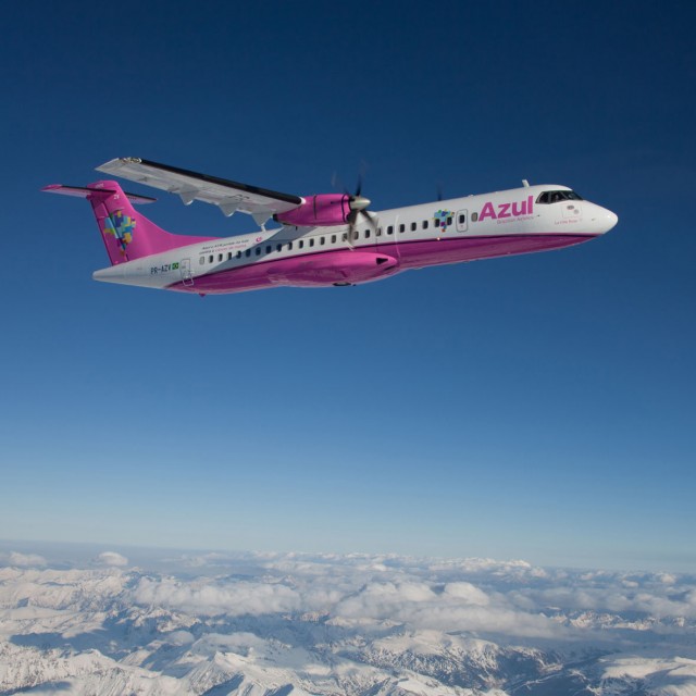The pink livery looks great contrasted to the blue sky.