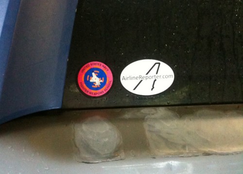 Airline Reporter sticker next to a Top Gun - Naval Fighting Weapons School - sticker.