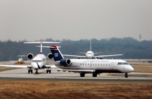 US Airways Express (PSA) CRJ 200 on the taxiway followed by ’œCompany Traffic’ CRJ 700