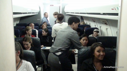 The inside of the mock Boeing 717 with new flight attendants waiting to be served.