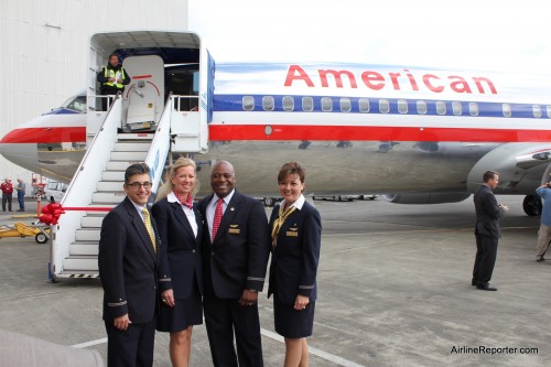 American Airline's flight crew are ready to welcome guests to see the new Sky Interior at Boeing's delivery center at Boeing Field (BFI).