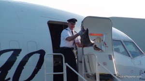 Alaska Airline's Captain bringing out the first Copper River Salmon that is 46lbs.