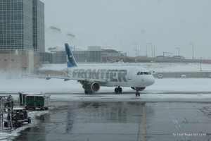 Frontier Airbus A319 in the snow at Denver.