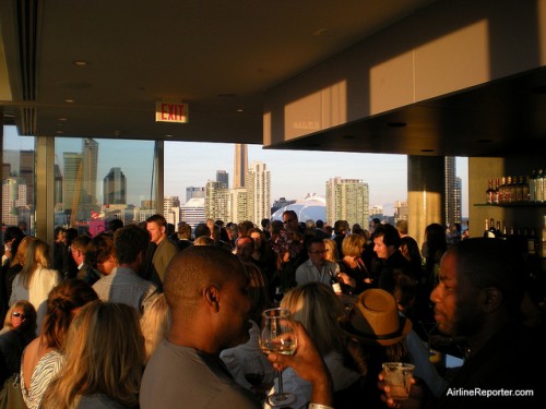 Bunch of people having a good time on the roof of the Thompson Toronto Hotel