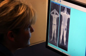 A person checks a body scan image.