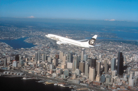 Alaska Airlines flying over Seattle