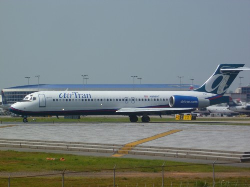 Mad Dog Wannabe: An AirTran Boeing 717 taxis onto Runway 18L at Charlotte Douglas International Airport.