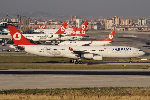 A nice Turkish Airlines Airbus A340 up front, lots of other Turkish planes in the background.