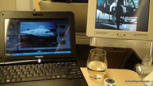 Flying, blogging, drinking and watching a movie. What else do I need? (anyone guess that movie?).