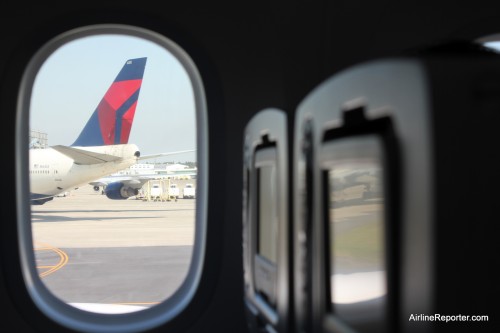 We are on our way. Even though I did not have a window seat, I could see outside quite well. A Delta Air Lines Boeing 747-400 at Narita can be seen.