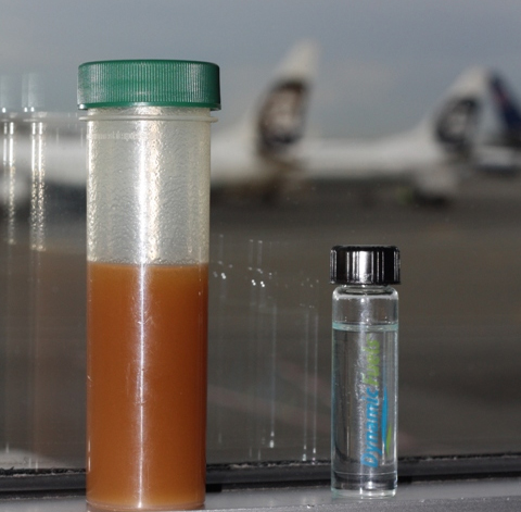Before and after photo. On the left is used cooking oil and on the right is the processed biofuel. Check out the Alaska 737's in the background. Photo from Boeing.