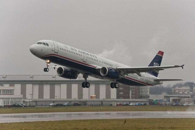 HI-RES PIC (click for larger): The 7000th Airbus aircraft, an A321 for US Airways, takes off. Check the German flag on the tail. Photo from Airbus.
