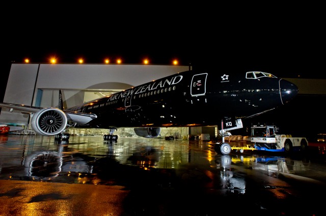 HI-RES IMAGE (click for larger). Air New Zealand's All Black Boeing 777-300ER comes out of the Boeing paint hangar. Photo by Boeing. 