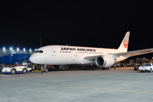 HI RES IMAGE (click for larger). JAL's first Boeing 787 rolls out of the paint hangar in new livery. Photo by Boeing.