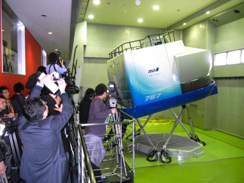 Japanese reporters getting a look at one of the two 787 full flight simulators in action at the Boeing/ANA training campus in Tokyo on March 7. Photo by Boeing.