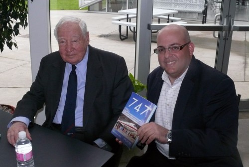 Chris Sloan (on the right) gets his Boeing 747 book signed by Joe Sutter (father of the 747) during the recent Lufthansa 747-8I Delivery.