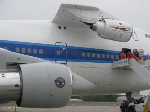 Can you spot what is different about this Boeing 747-100? If you guessed the engine attached to the upper deck -- you win. Pratt & Whitney is testing the PW1200G engine. Photo by Guy Norris.