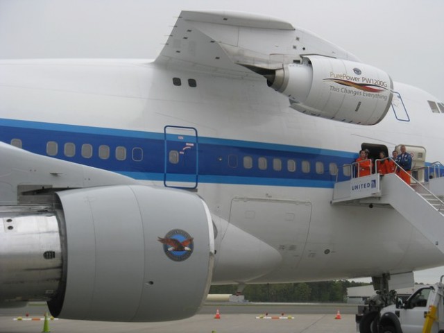 Can you spot what is different about this Boeing 747-100? If you guessed the engine attached to the upper deck -- you win. Pratt & Whitney is testing the PW1200G engine. Photo by Guy Norris. 