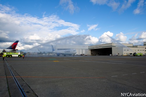 The 767 receives a water canon salute.