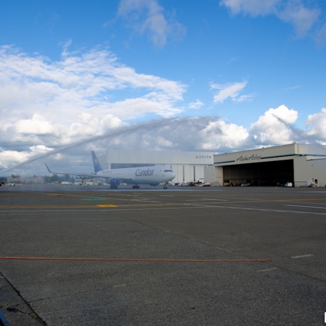 The 767 receives a water canon salute.