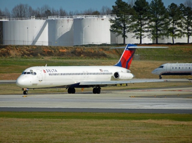Delta DC-9 taxis onto Runway 18C at Charlotte, NC. Photo by Andrew Vane.