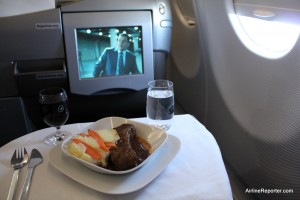 Yum! This was one of three courses. Being served in glasses with the airline's logo is a nice touch. Yes, I was watching a movie with Matt Damon.