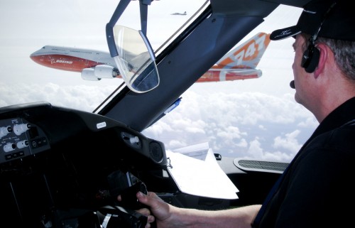 787 Chief Pilot Mike Carriker looks out at the 747-8 Intercontinental. Photo by Boeing.