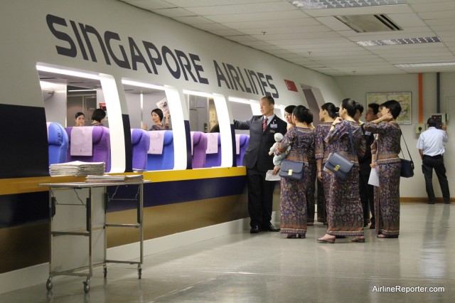 New Singapore Girls learn how to work the economy section at the training facility.