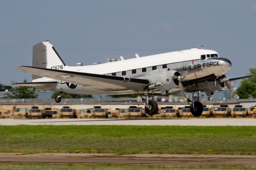 A DC-3 in Air Force livery lands at Oshkosh.