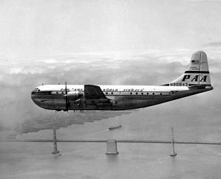 Pan American Airways Boeing 377 Stratocruiser over San Francisco-Oakland Bay Bridge, ca. 1947. Photo from the University of Washington.